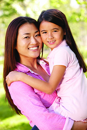 A Mother With Her Daughter Smiling