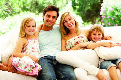 A Happy Family Sitting Together