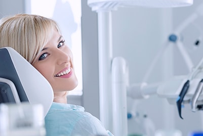 woman in dental chair smiling