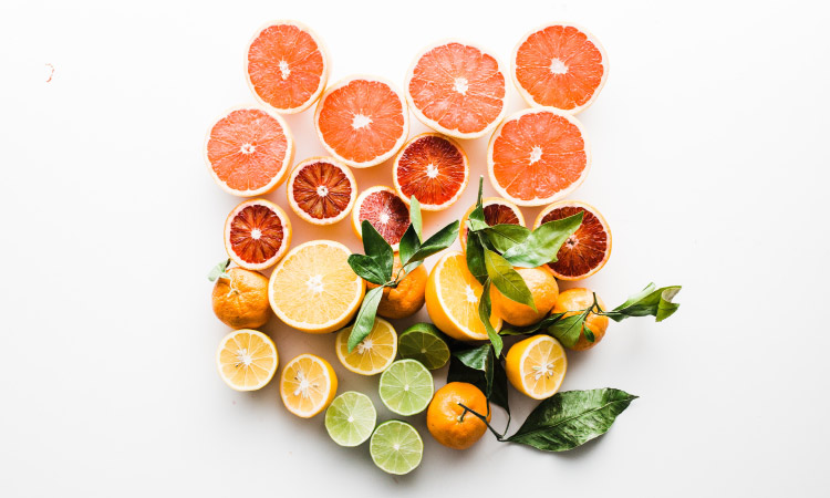 Aerial view of a cluster of acidic grapefruits, oranges, lemons, and limes